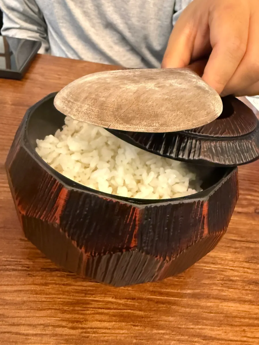 Small rice pot served with a rice paddle