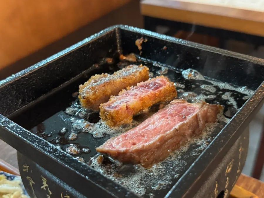 Gyukatsu and steak placed on the tabletop grill