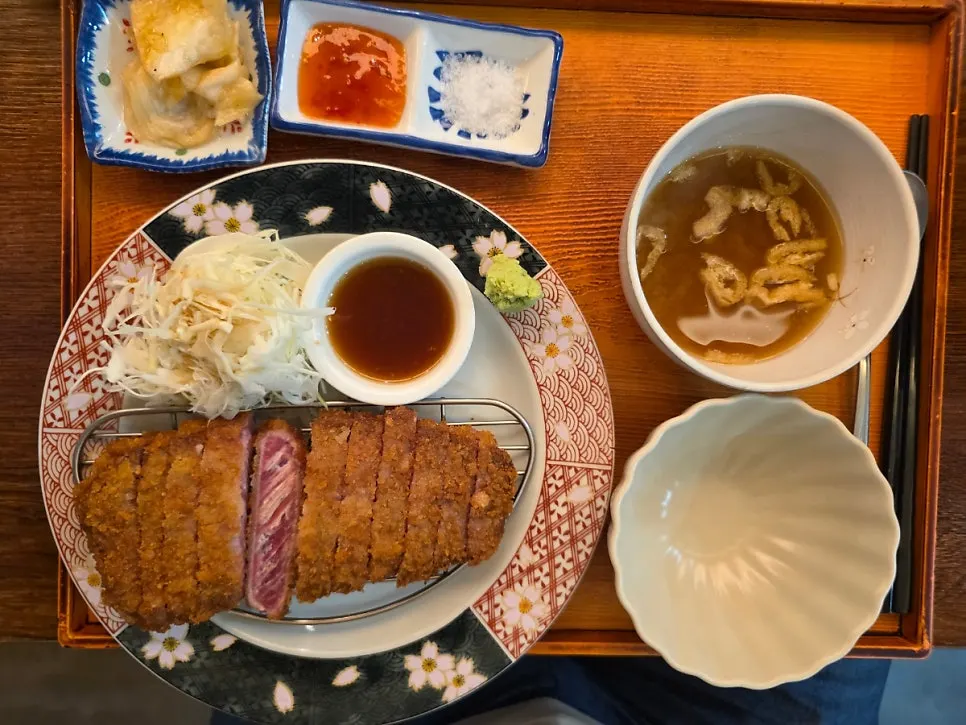 A piece of gyukatsu grilled crispy outside and tender inside