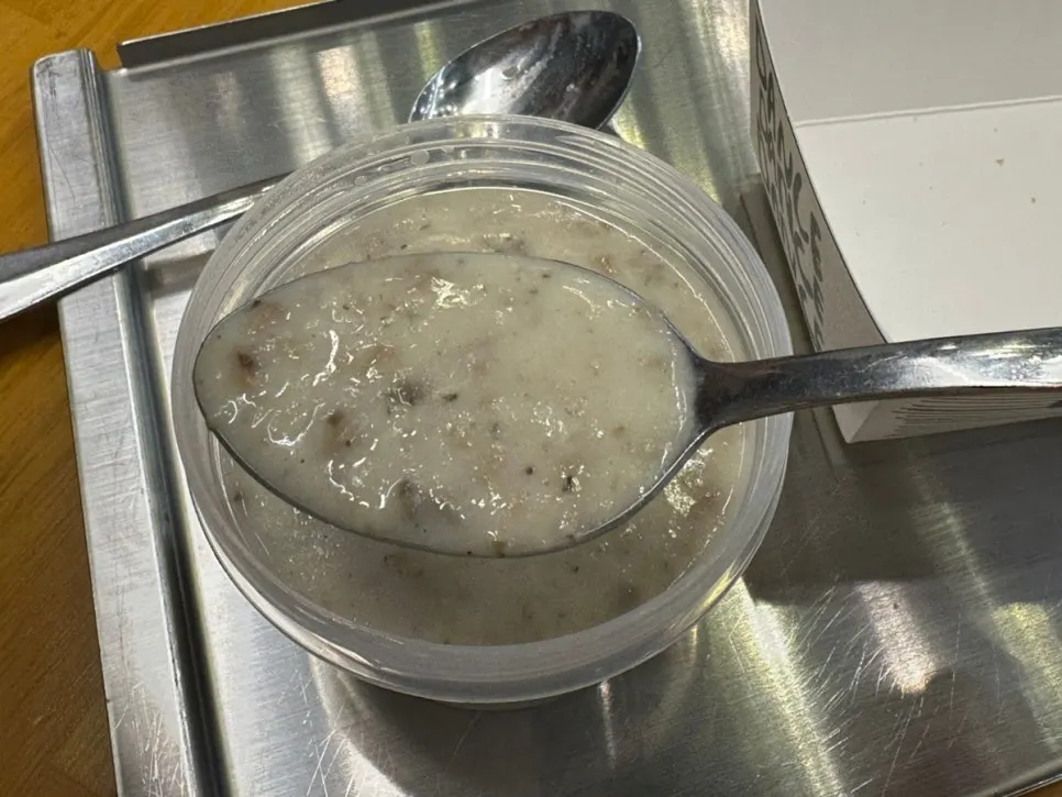 Warm mushroom soup ordered alongside the sandwich