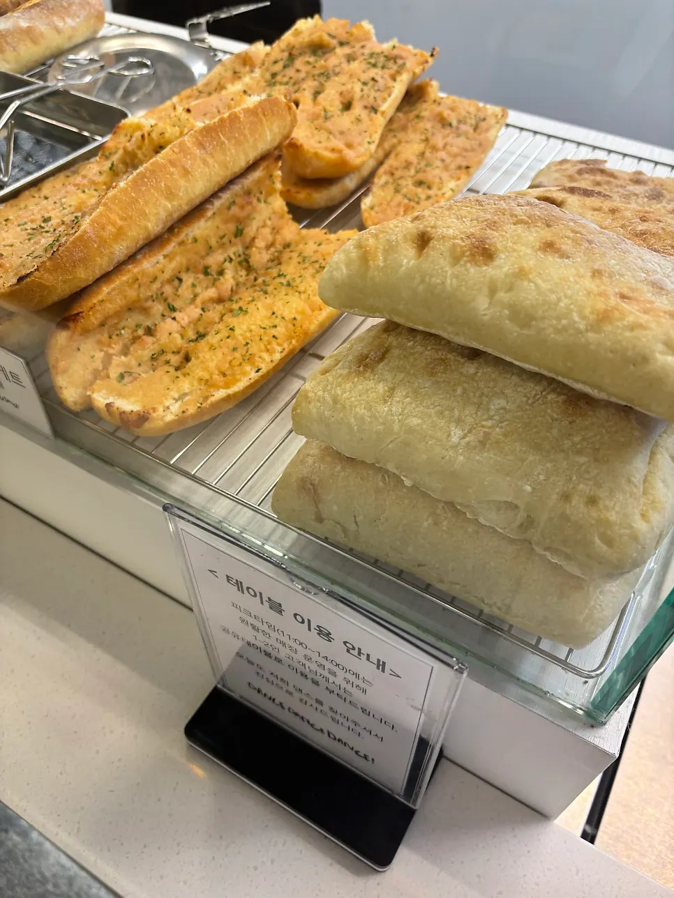 Baguettes and ciabatta displayed in the showcase