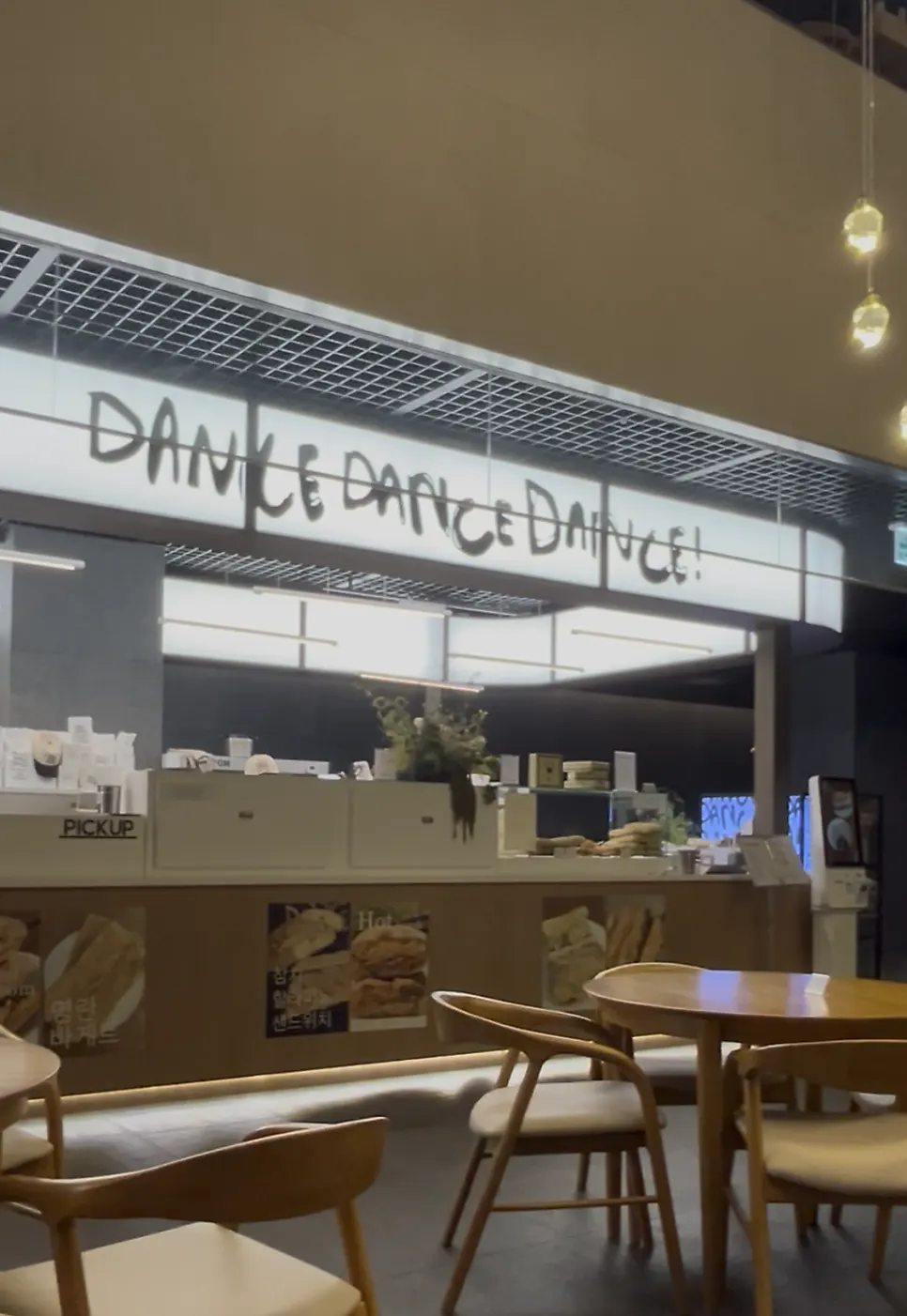 Exterior of Dance Dance Dance Seoul Station with the SANDWICH & COFFEE sign