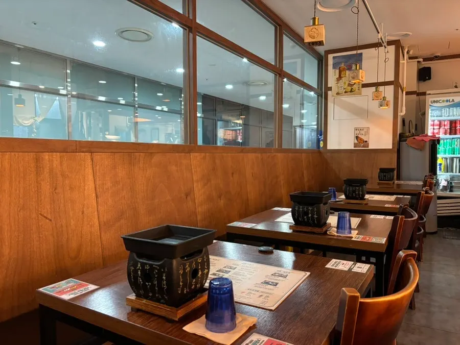 Table seating and tabletop brazier at Ichigyu Seoul Station Branch