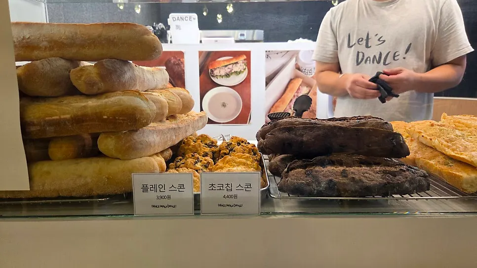 Bakery case with scones and chocolate baguettes