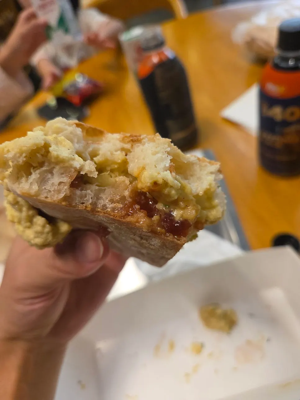 Egg potato sandwich held up for a closer look