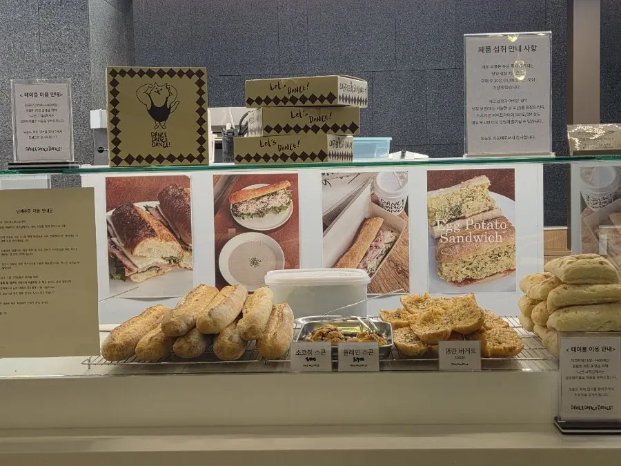 Display of baguettes, ciabatta, and desserts