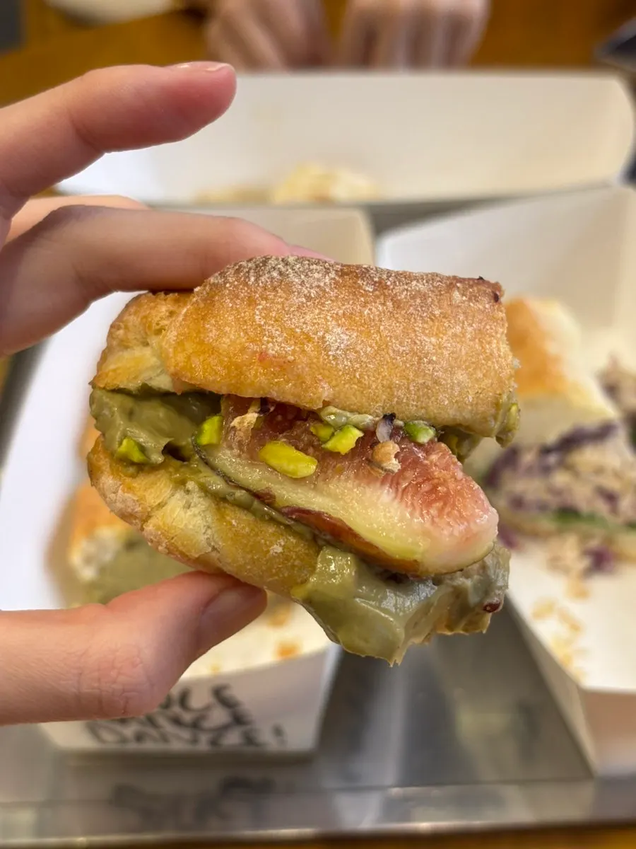 Baguette showing the pistachio tofu cream cheese