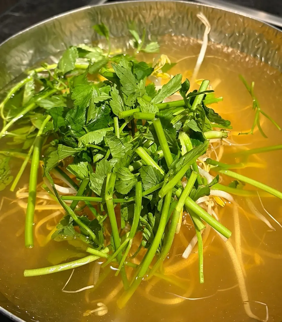 Pot of clear anchovy broth shabu-shabu