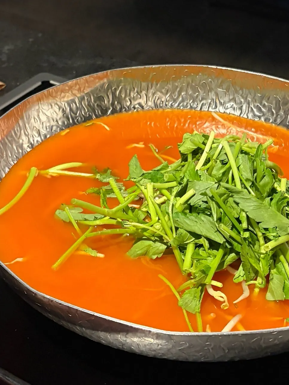 Pot of spicy mushroom broth shabu-shabu