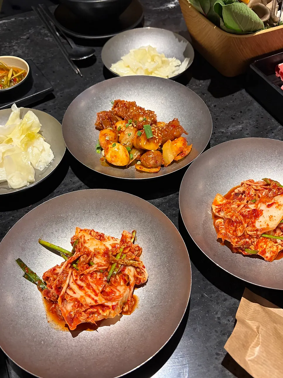 Plate of sauces including chili sauce and peanut sauce
