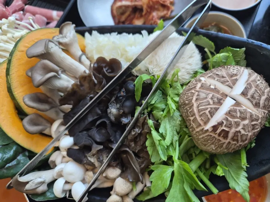 Cooking meat and mushrooms in the broth