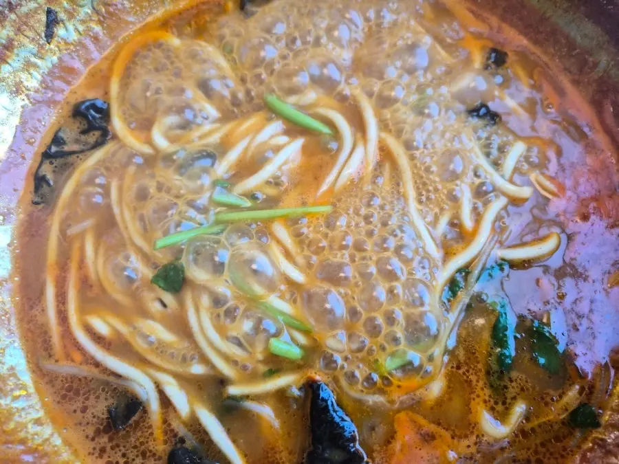 Kalguksu noodles cooked in the shabu broth