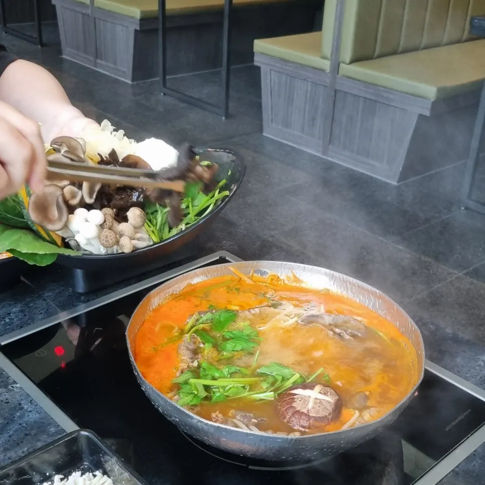 Close-up of the spicy broth hot pot at Yunseul