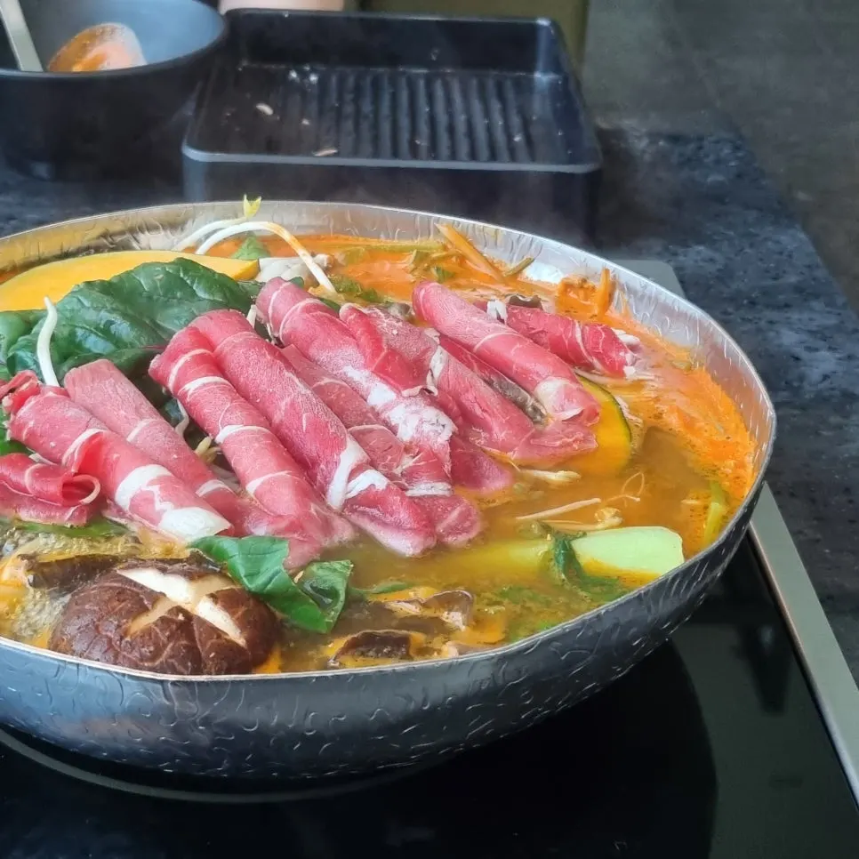 Minari gondol-i jeon served alongside the shabu-shabu spread