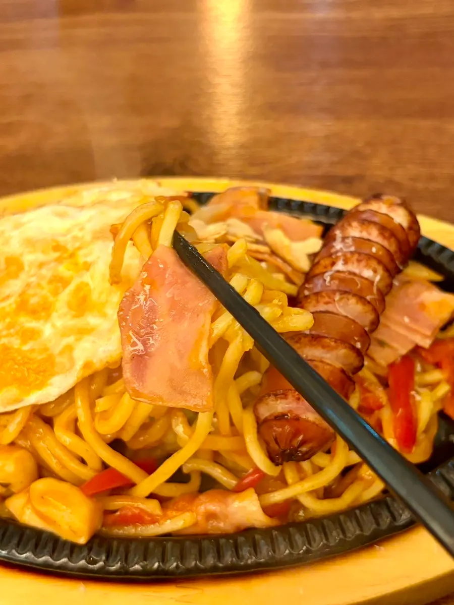 Yakisoba Napolitan topped with a soft-boiled egg