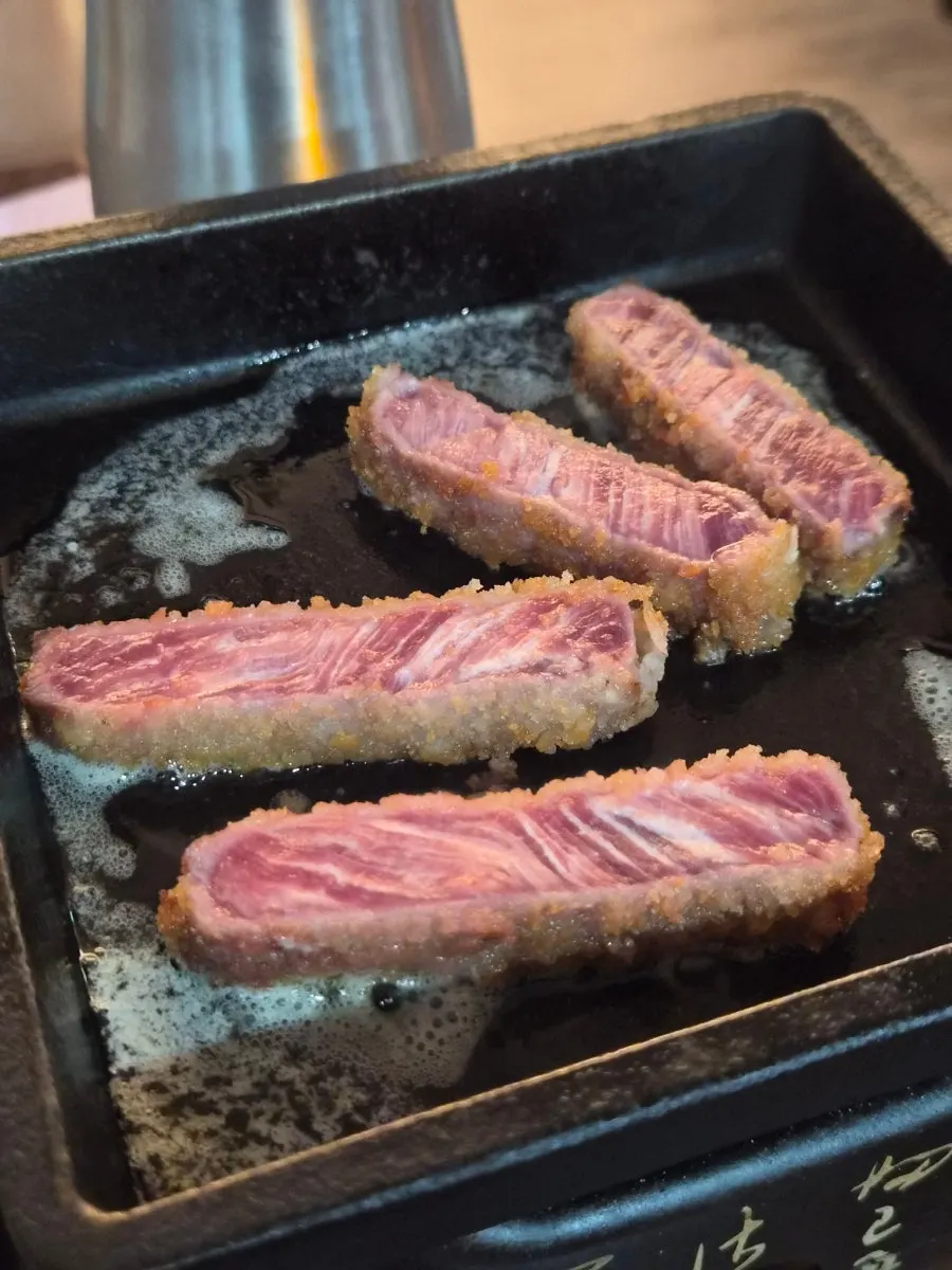 Gyukatsu placed on the grill