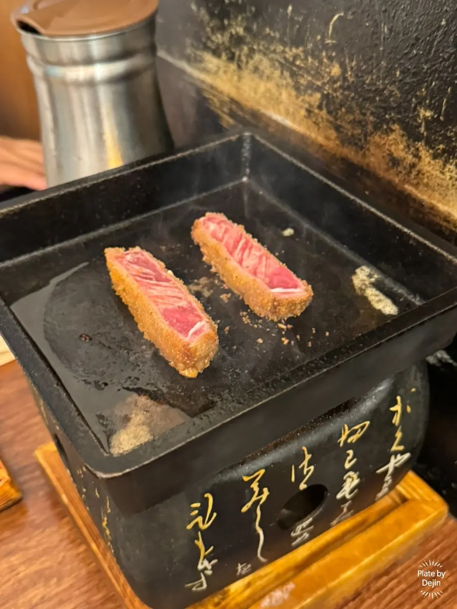Butter and gyukatsu on a hot plate