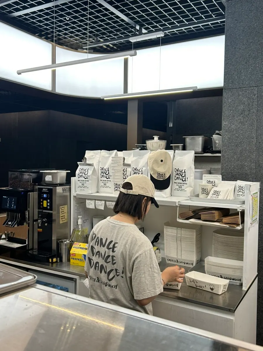 Staff member wearing branded goods