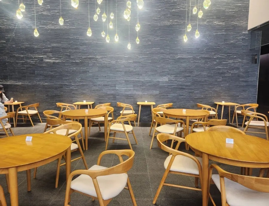 Seating area with multiple tables at Dance Dance Dance Seoul Station