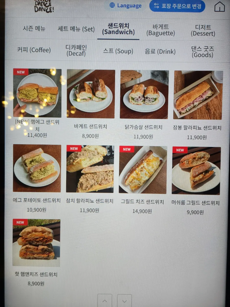 Menu board showing ham egg and chicken breast sandwiches
