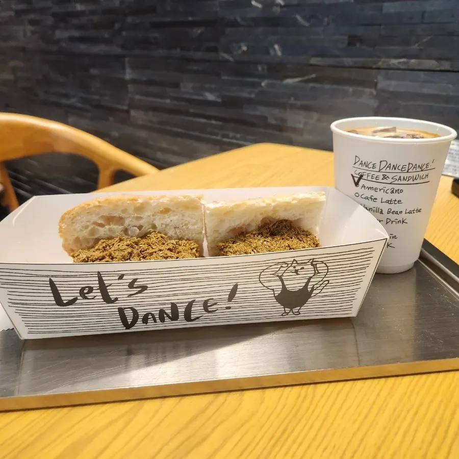 Dubai pistachio baguette served with an iced Americano