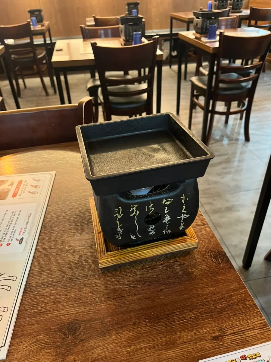 Open kitchen at Ichigyu Seoul Station Branch visible from the dining area