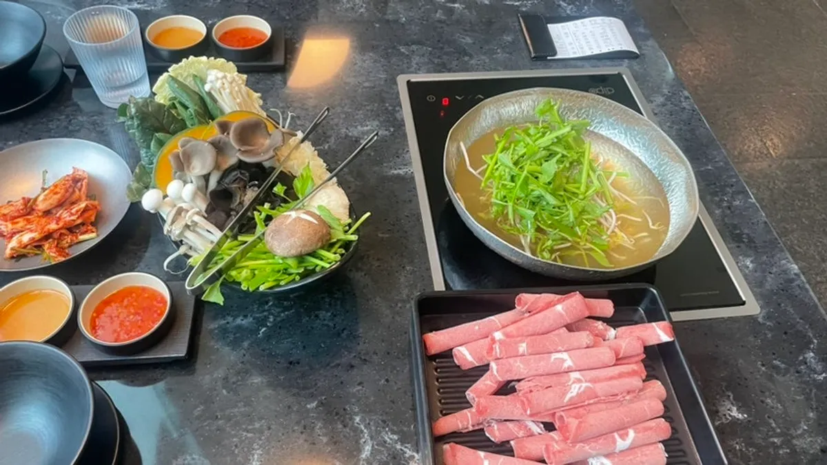Cabbage, kimchi, and braised beef tendon side dishes