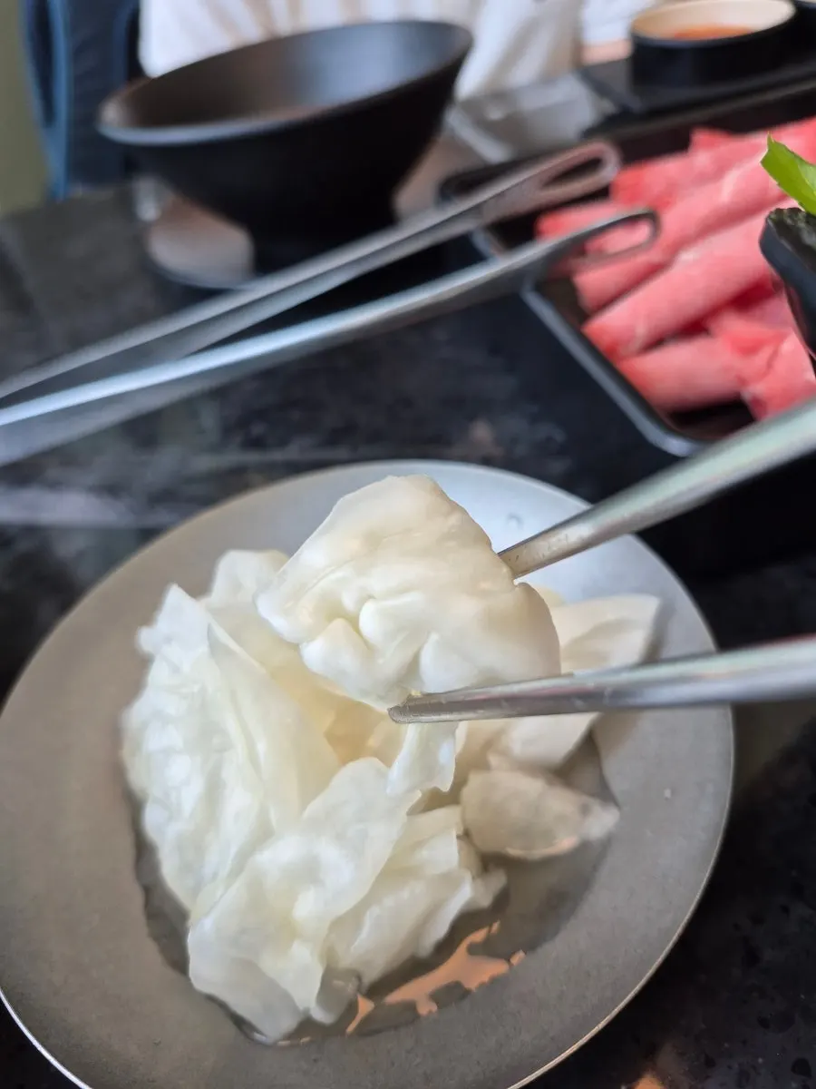 Homemade kalguksu in shabu-shabu broth