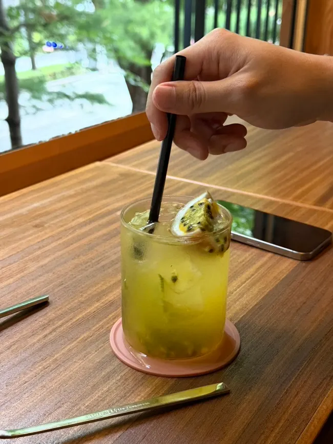 Iced passionfruit ade generously filled with fruit pulp