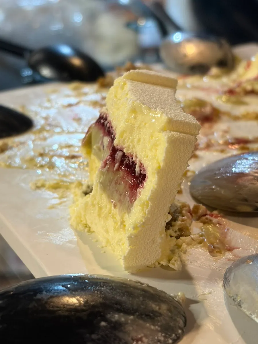Cake cross-section with cassis berry and pistachio cream