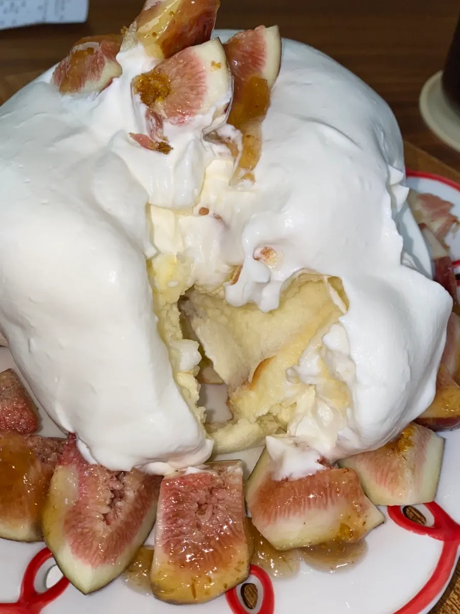 A bite of soufflé with fig on top