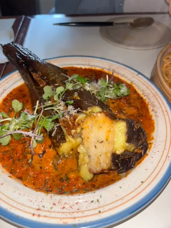 Eggplant and shrimp topped with rosé sauce