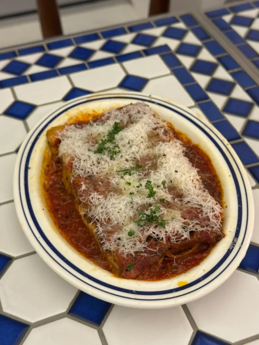 Close-up of the cheese-covered aligot cheese lasagna