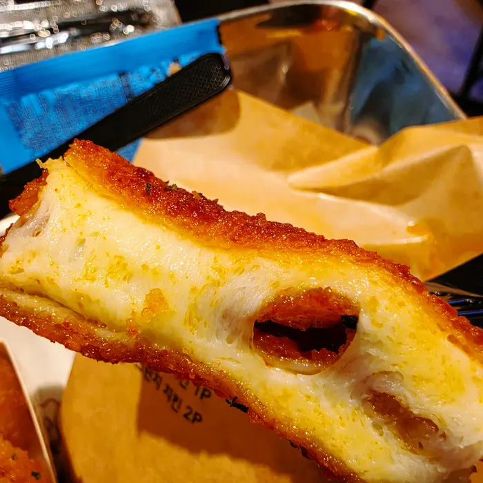 Cross-section of the chili mozza cheese bar after one bite
