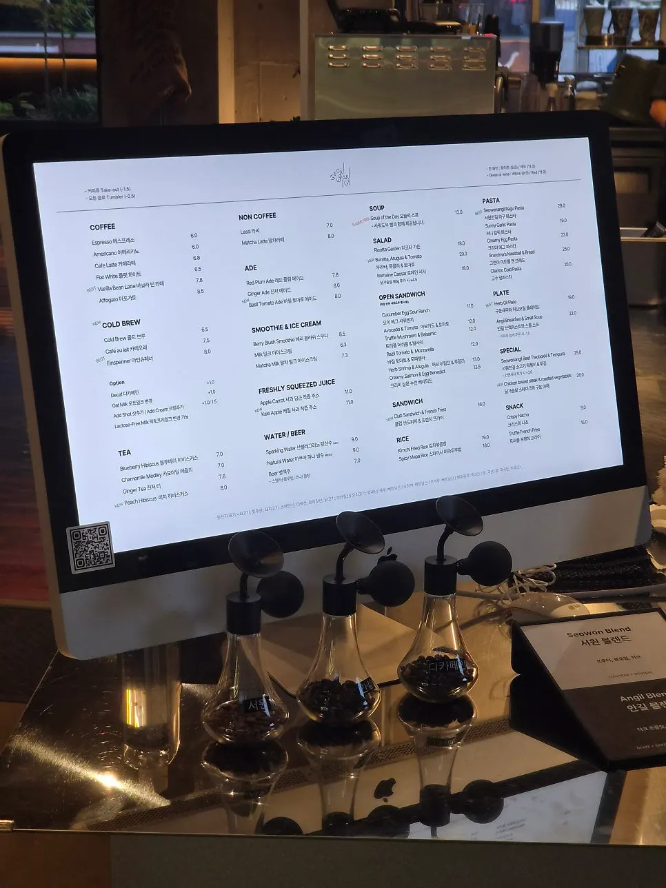 Menu board featuring both café drinks and food