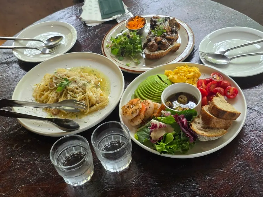 Pasta and plate served together on the brunch table