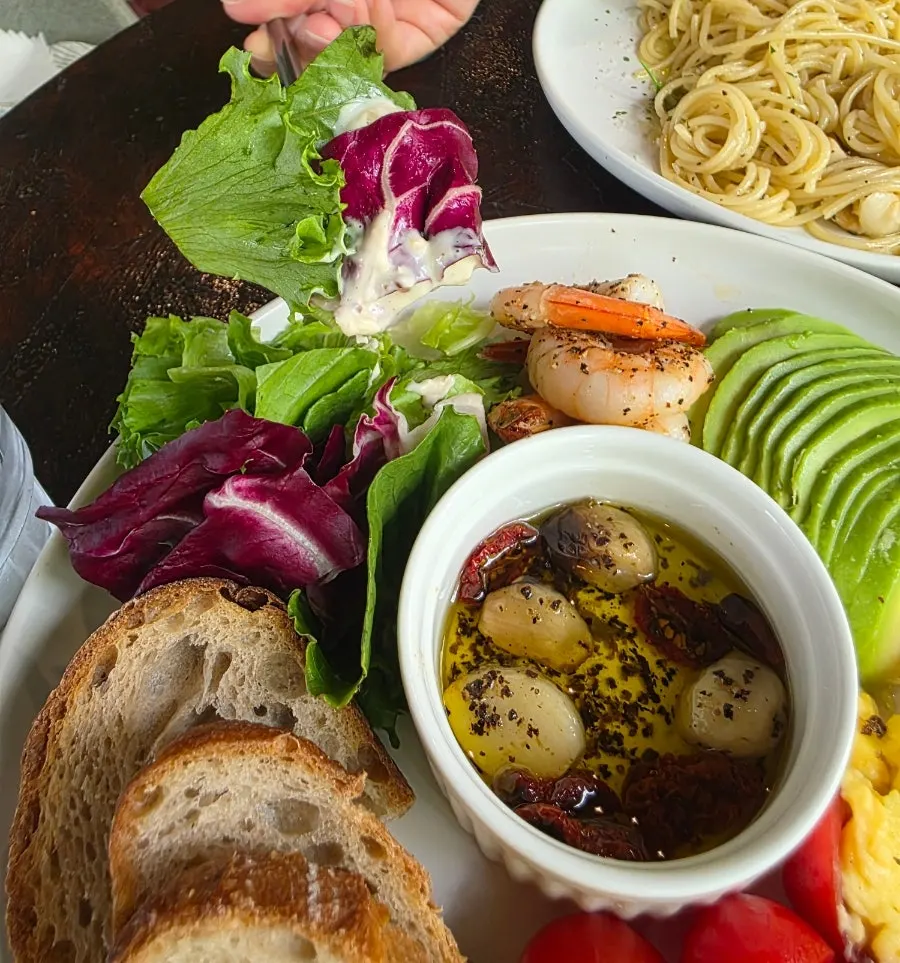 Sourdough served alongside the Herb Oil Plate