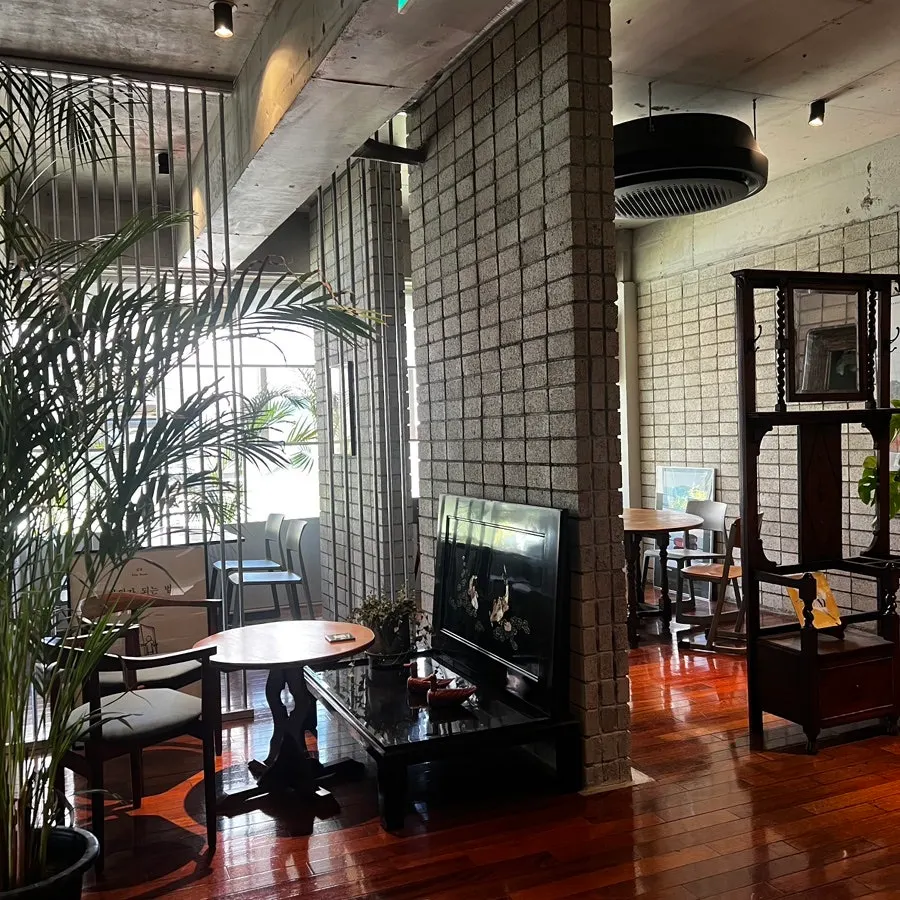 Interior of Seowon Angil Hapjeong with plants and wood décor