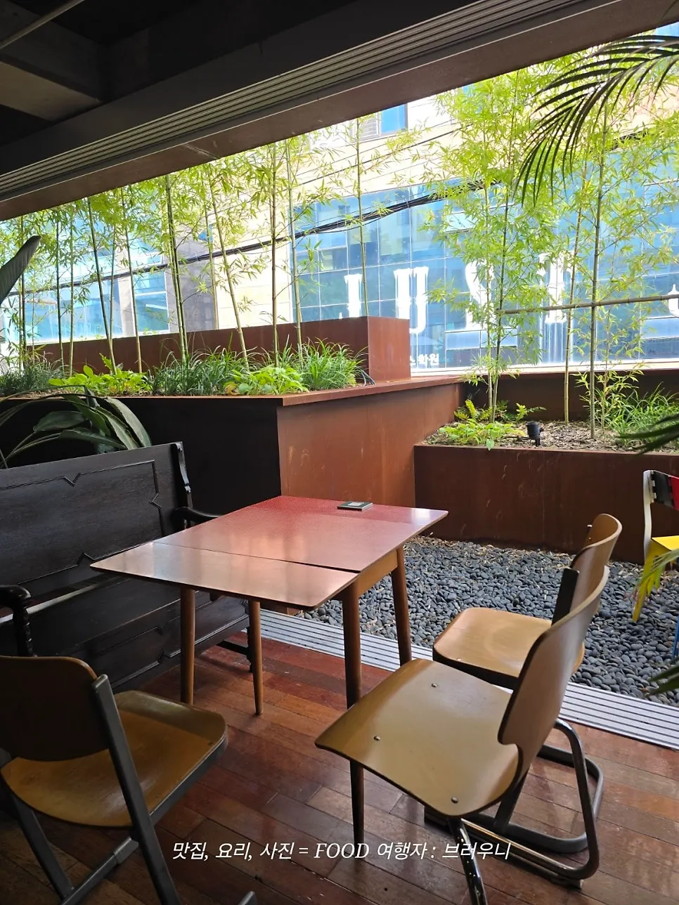 Café seating decorated with plants, planterior style