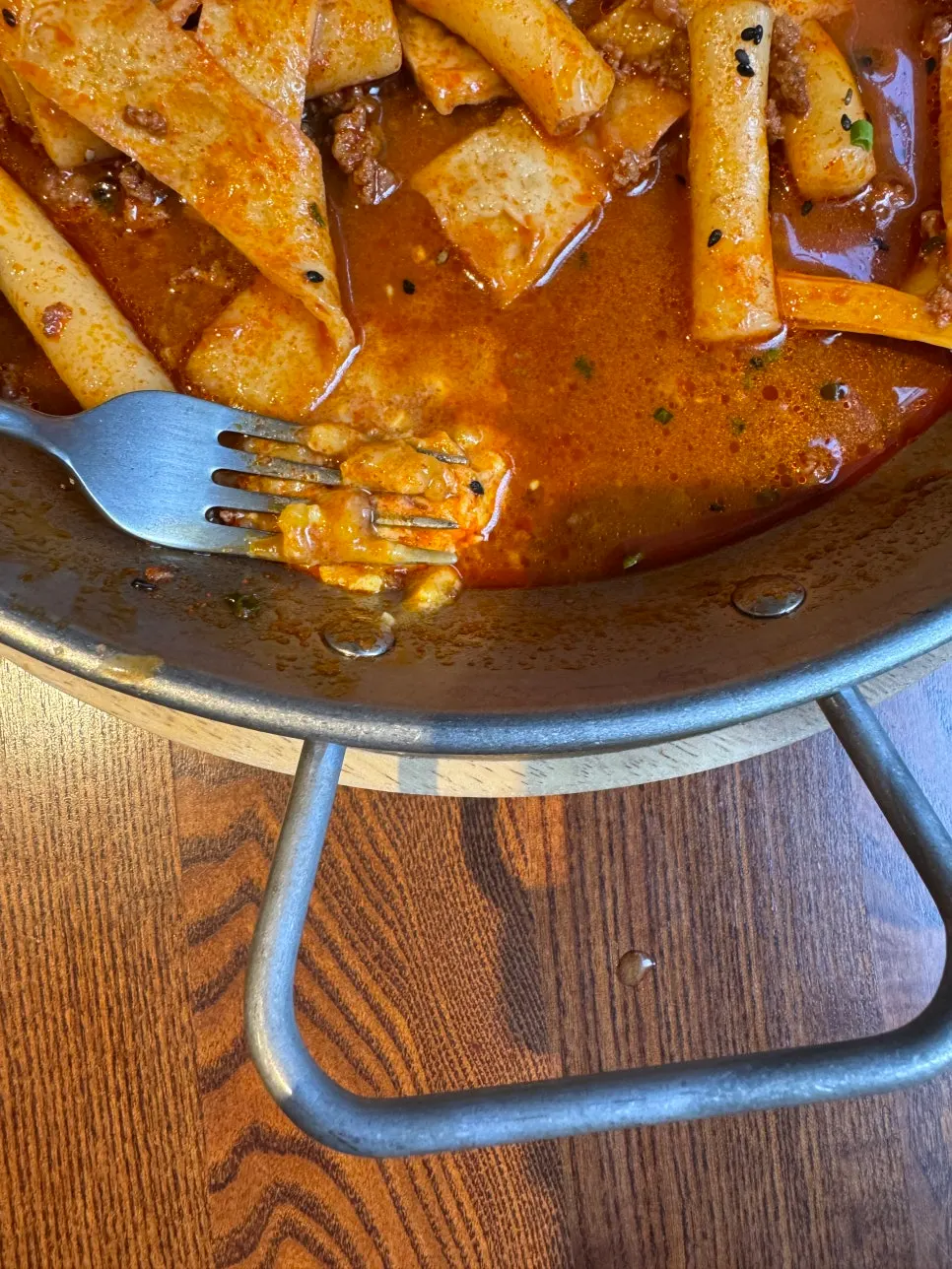 Dumpling dipped in tteokbokki sauce