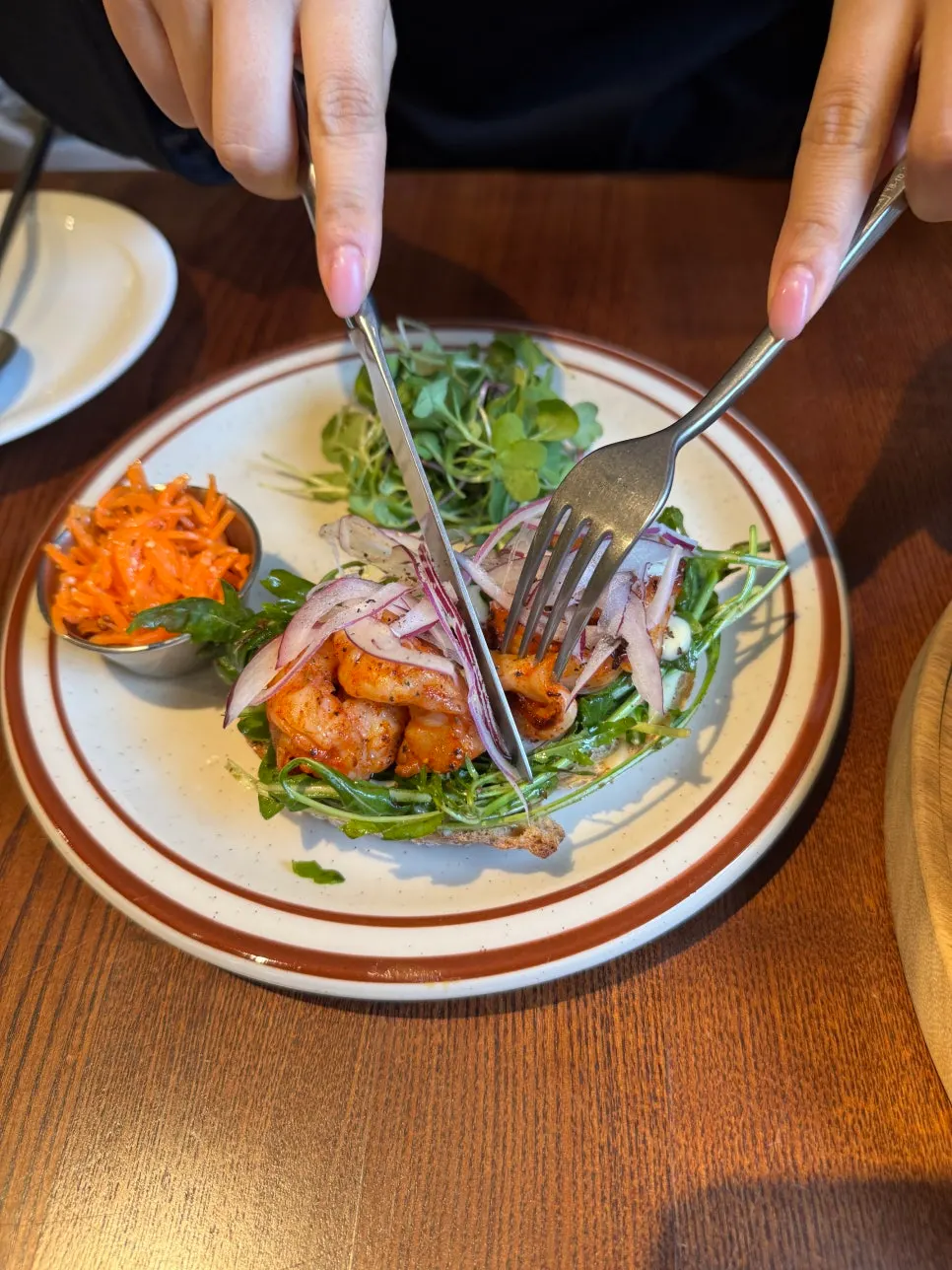 Plating of the herb shrimp arugula sandwich