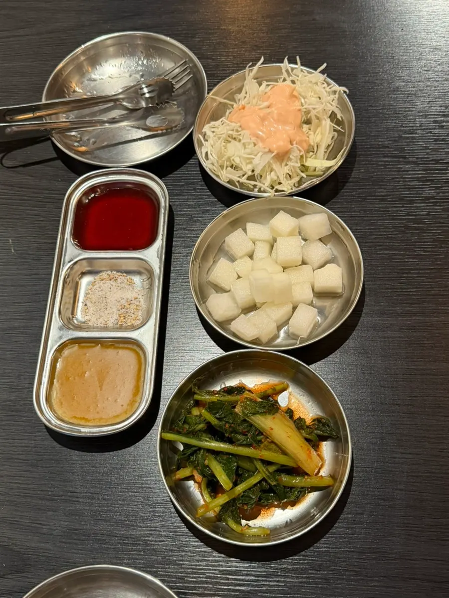 Basic side dishes: cabbage salad, radish, and yeolmu kimchi