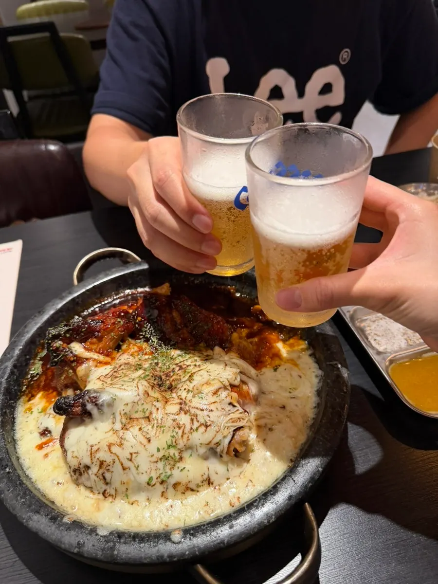 Cold beer ordered alongside the half-and-half chicken on the stone plate