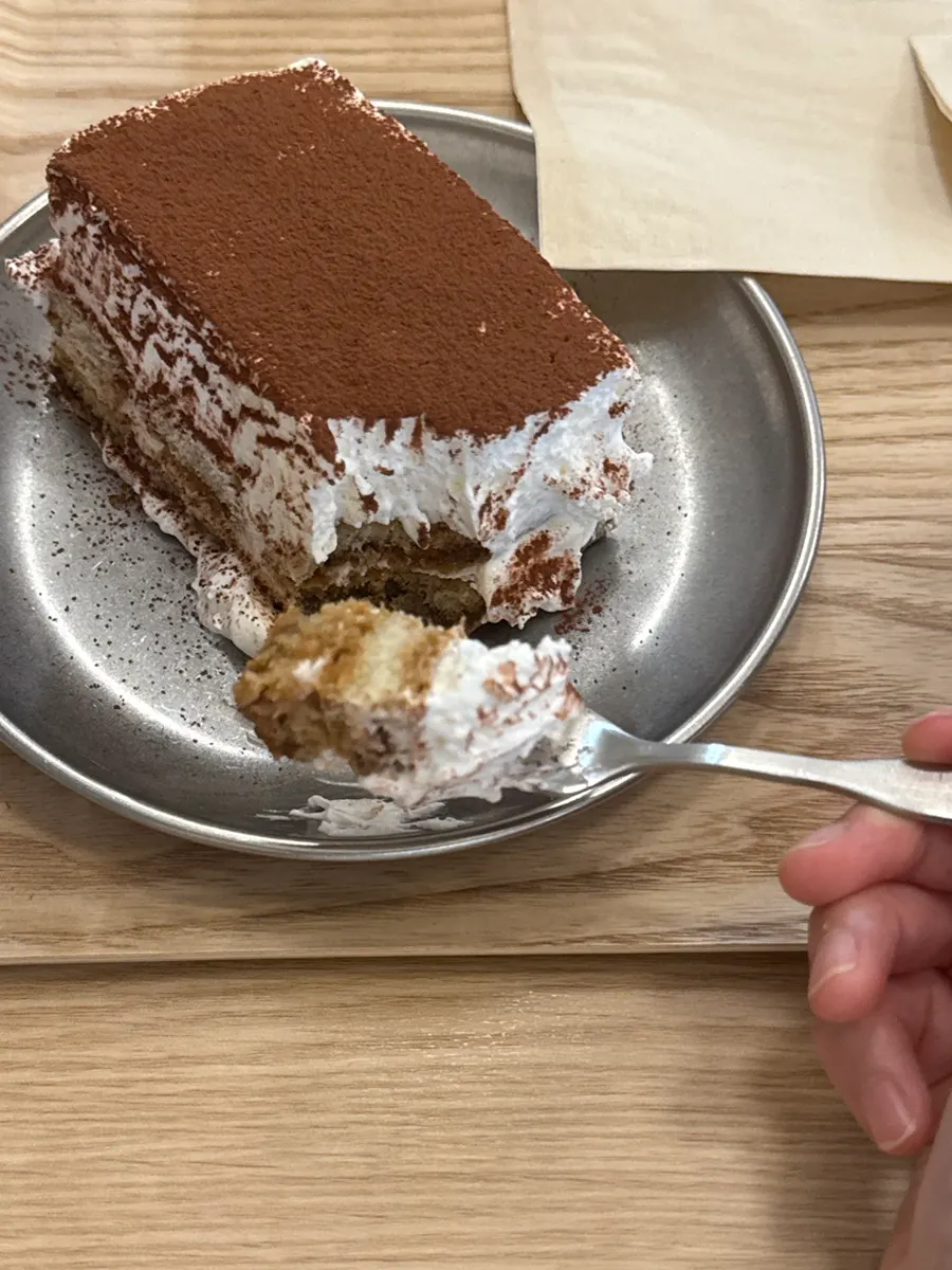 Cross-section of tiramisu cream scooped with a spoon