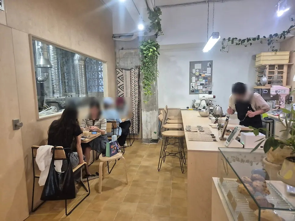 Sese Coffee's indoor space decorated with plants
