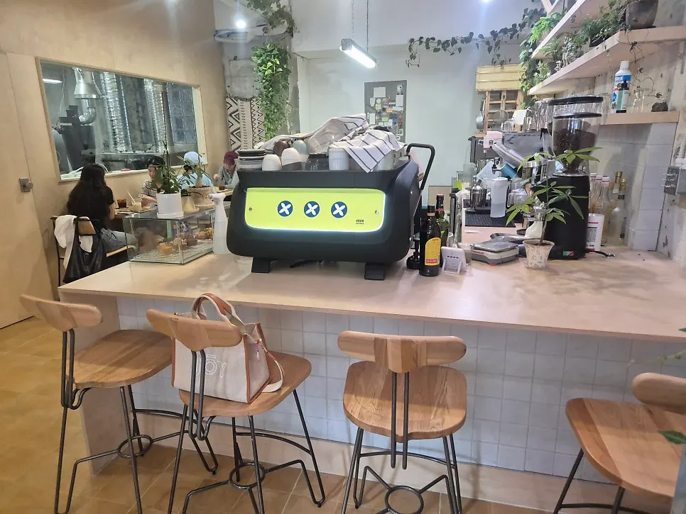 Sese Coffee seating with mostly two-person tables