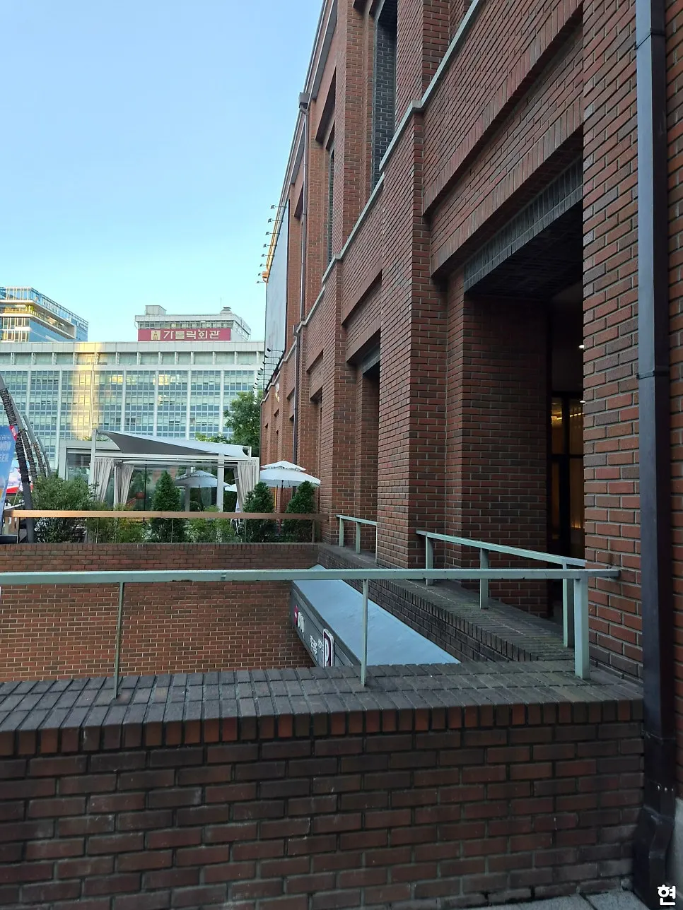 Entrance to Seventy Four Myeongdong Cathedral Main Branch near the outdoor terrace