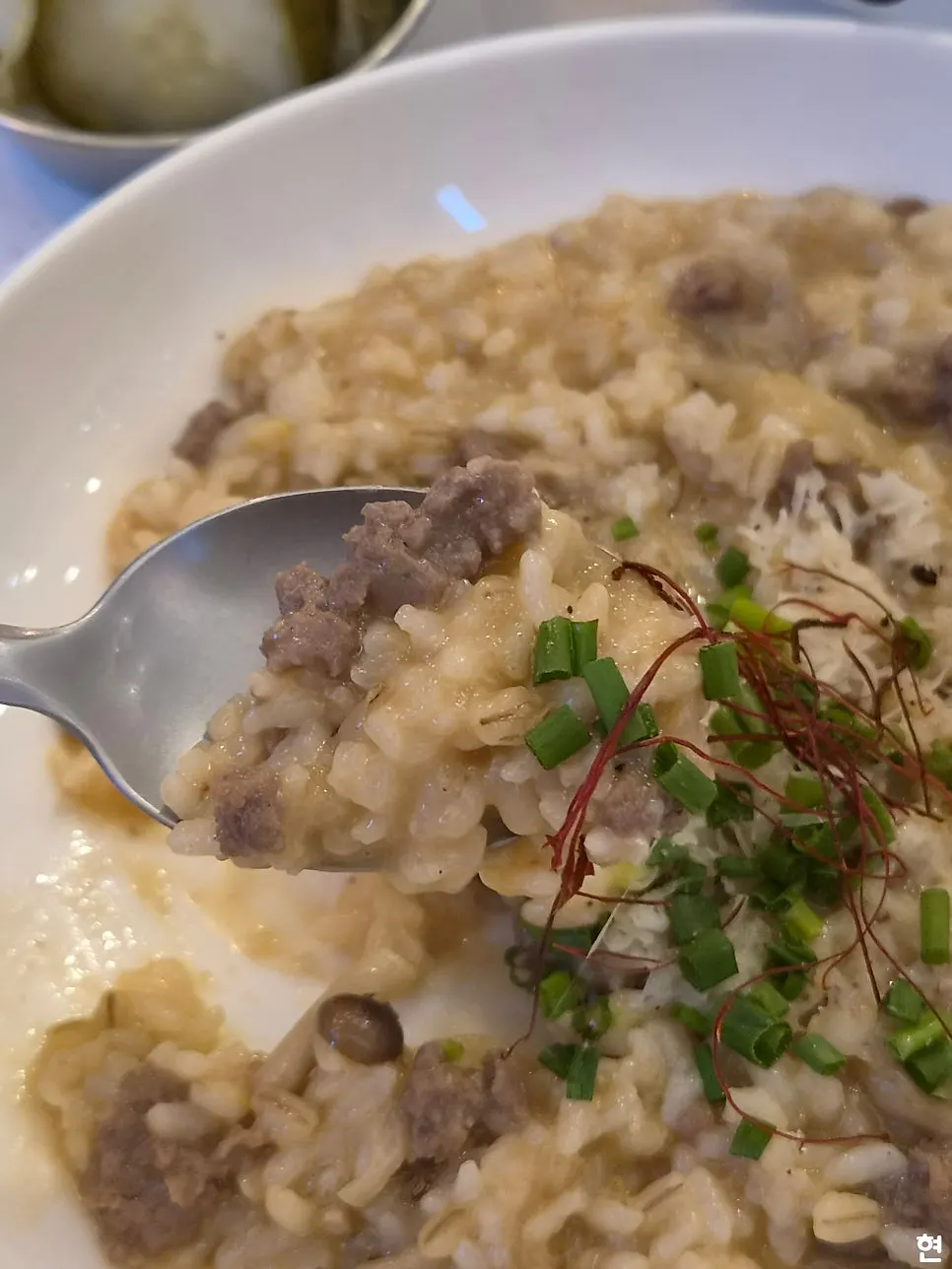A spoonful of barley-mixed risotto