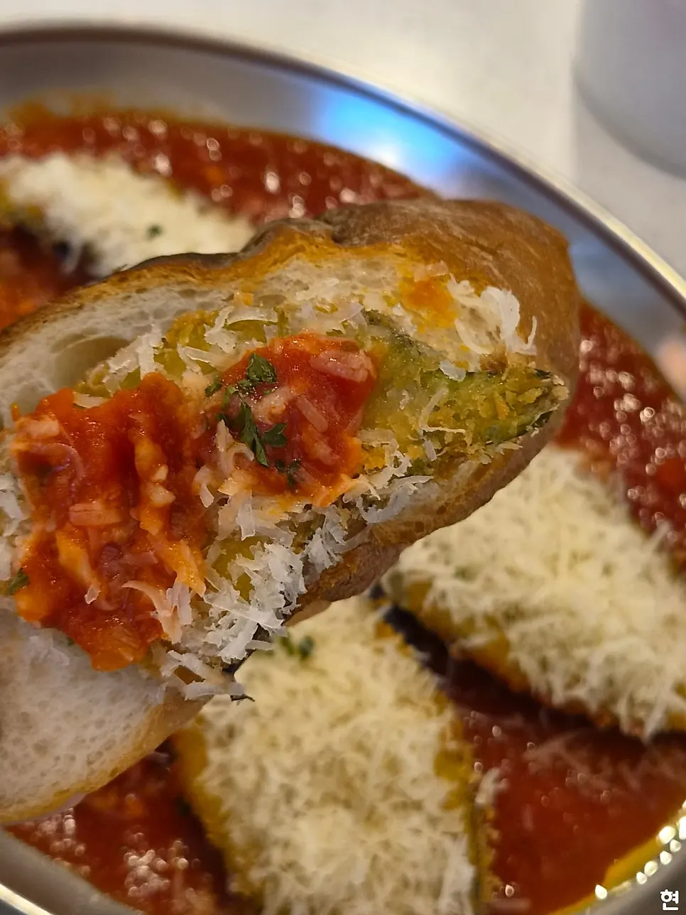 Unexpected Eggplant topped with tomato sauce and cheese