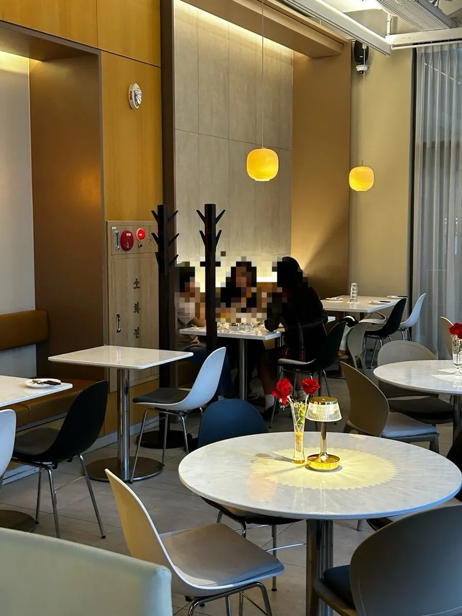 Terrace seating overlooking the Myeongdong Station street